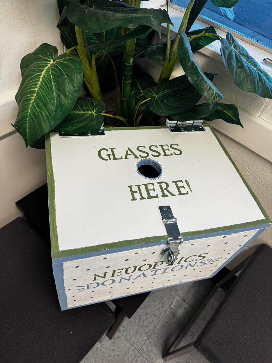 Top view of NeuOptics donation box showing glasses slot