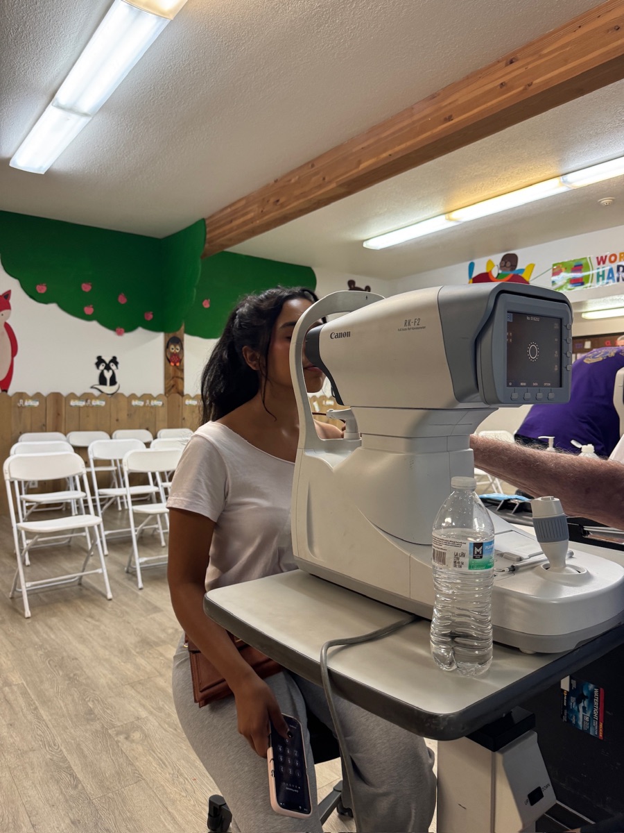 NeuOptics team member getting vision tested at a screening event